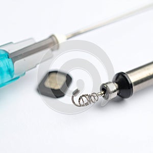 Deconstructed Microswitch Components on a White Background