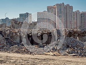 Deconstruction of building in front of new buildings