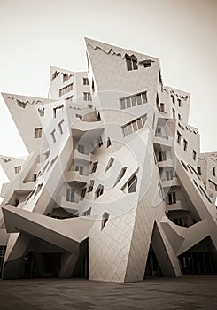 Deconstructivist Architecture: Modern Building with Angular Facade and Irregular Windows