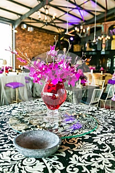 Decor with candles, flowers and lamps for a large corporate party event or Gala Dinner