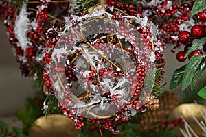 Decor and Christmas decorations made of artificial red berries and branches in the snow