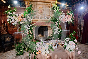 decor of fresh flowers in the restaurant for a wedding banquet.