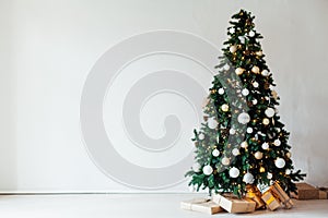 Decor of the house with christmas tree with New Year`s Thanksgiving gifts