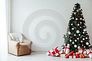 Decor of the house with christmas tree with New Year`s Thanksgiving gifts