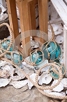 Decor in the maritime theme, anchor, glass bowls, shells, lanterns, ropes.