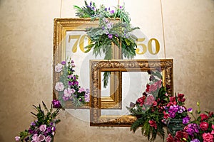 Decor of the photo zone with the numbers fifty and seventy, a place for a photo shoot