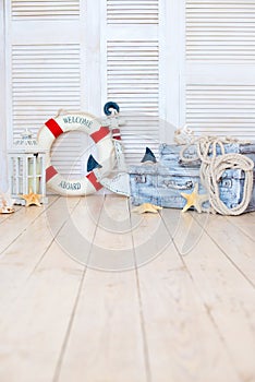 Decor in the style of sea travel, Suitcases and anchor, lifebuoy, lantern