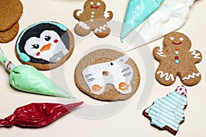 Decorate Christmas handmade gingerbread cookies with icing, icing sugar.