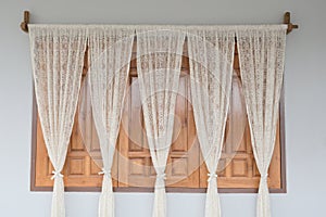 Decorate window with white curtain.