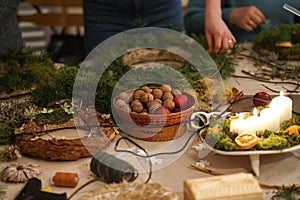 Decorated Advent wreath made of moss, dried flowers and fruits