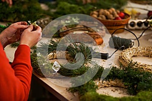 Decorated Advent wreath made of moss, dried flowers and fruits