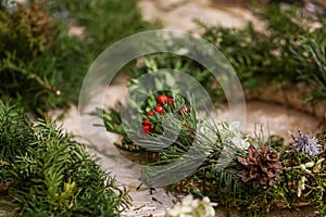 Decorated Advent wreath made of moss, dried flowers and fruits