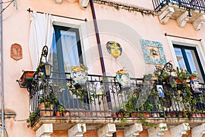 Decorated balcony of urban house in Taormina