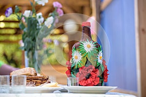 Decorated big bottle of alcohool