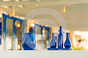 Decorated  blue bottles on the table