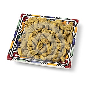 Decorated bowls with miniature shortbread cookies, called Krichlate close up on white background