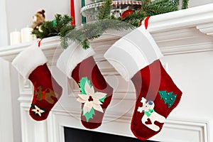 Decorated bright red Christmas socks hanging