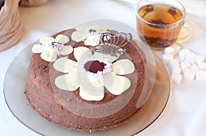 Decorated brown cake with cacao icing