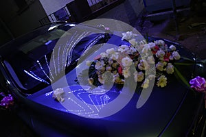 decorated car with flowers for a wedding
