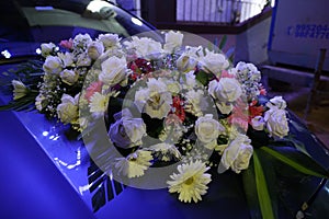 decorated car with flowers for a wedding