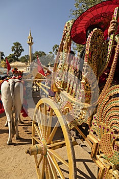 Decorated carriages with golden motifs, during the Shinbyu, a novitiation ceremony, Myanmar