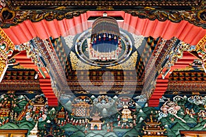 Decorated ceiling that tell about Buddha story in Bhutanese art inside The Royal Bhutanese Monastery in Bodh Gaya, Bihar, India