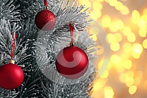 Decorated Christmas tree against blurred lights on background