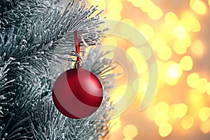 Decorated Christmas tree against blurred lights on background