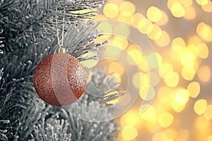 Decorated Christmas tree against blurred lights on background