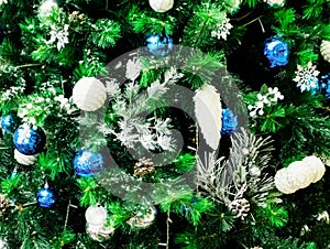 Decorated Christmas tree background, Beautiful Christmas fur-tree decorated with New Year`s toys, Christmas balls decorations on