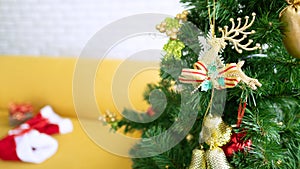 Decorated Christmas tree on blurred, sparkling and fairy whiteground