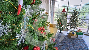 Decorated Christmas tree on blurred, sparkling and fairy whiteground