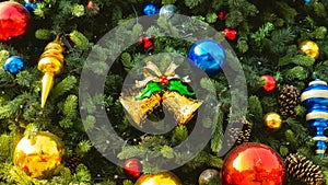 Decorated Christmas tree with colorful Christmas ball and gold bell adorn