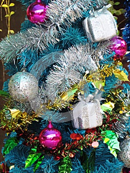 Decorated christmas tree with colorful ornaments.
