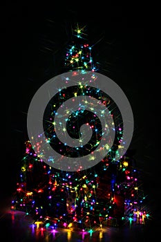 Decorated Christmas tree lit up with colorful lights