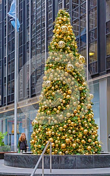 A decorated Christmas tree roadside in NYC