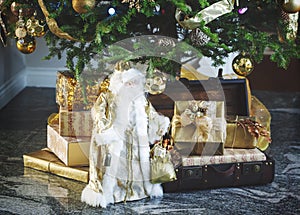 Decorated Christmas tree, Santa Claus and gift boxes