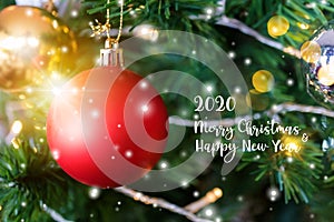 Decorated closed up Christmas tree on blurred, sparkling snowing and fairy abstract background of holiday lights bokeh with Merry