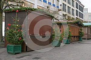 Decorated but closed wooden stalls before the opening of the Christmas market, hoping that the event will not be cancelled due to