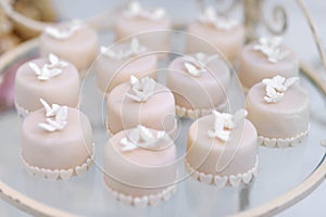 Decorated cupcakes on a glass plate