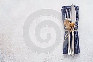 Decorated cutlery - fork and knife on a blue napkin