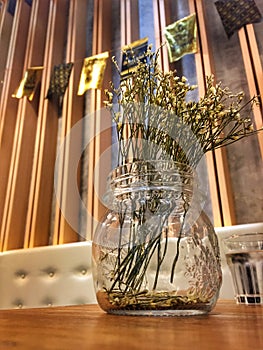 Decorated dry flowers in the glass jar