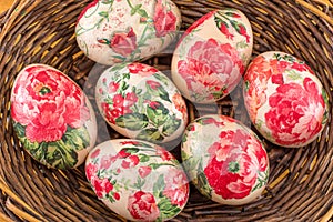 Decorated Easter eggs in a basket close up