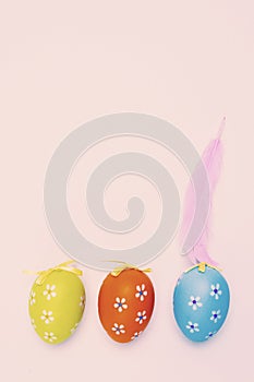 Decorated easter eggs and feather