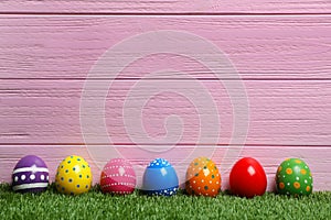 Decorated Easter eggs on green grass