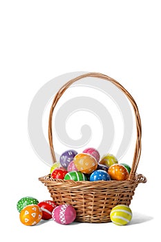 Decorated Easter eggs in wicker basket