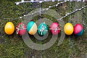 Decorated Easter eggs on wooden background