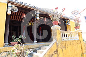 Decorated entrance and access stairs of Van Thanh mieu Cam Pho temple in Hoi An, Vietnam