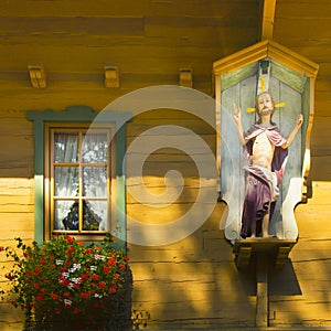 Decorated faÃ§ade made with timber with decorated windows Hainzenberg Austria photo