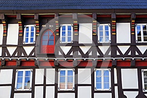 Decorated facade of medieval half-timbered house in Goslar, Germany